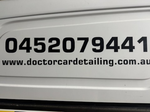 Doctor Car Detailing contact details on van